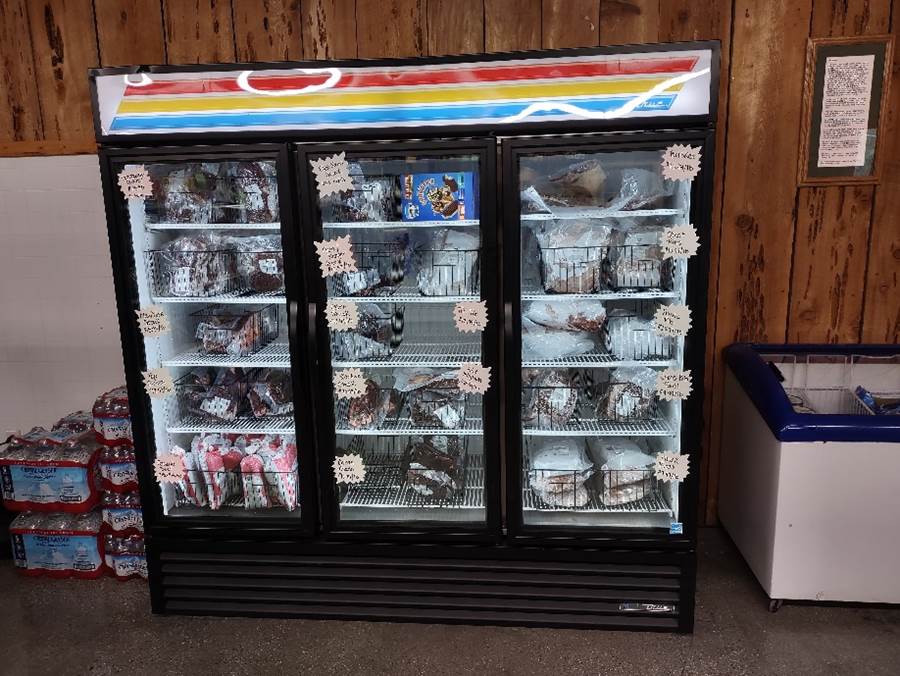 A freezer with a variety of items on it

Description automatically generated