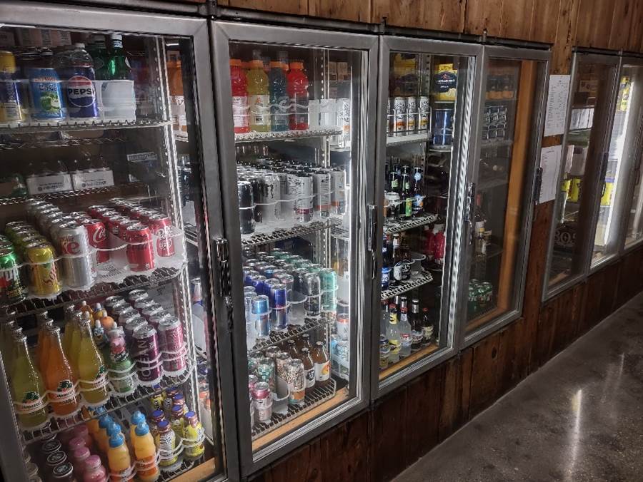 A refrigerator with drinks in it

Description automatically generated