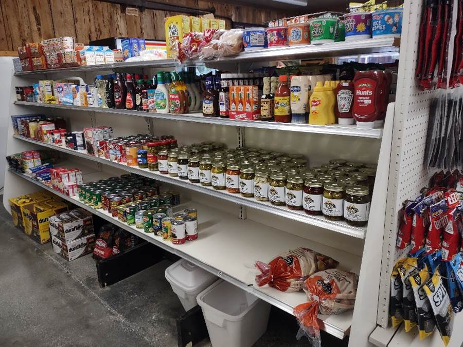 Shelves of food on shelves in a store

Description automatically generated