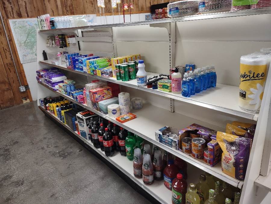 Shelves of a store with shelves of beverages

Description automatically generated